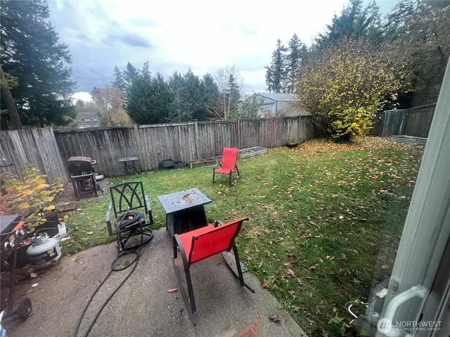 a backyard of a house with outdoor seating