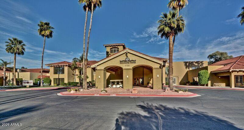14300 West Bell Road, Unit 49 Surprise, AZ 85374 - Photo 13 of 19 a front view of a building with street