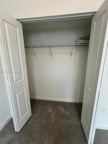 a view of a room with racks on the wall