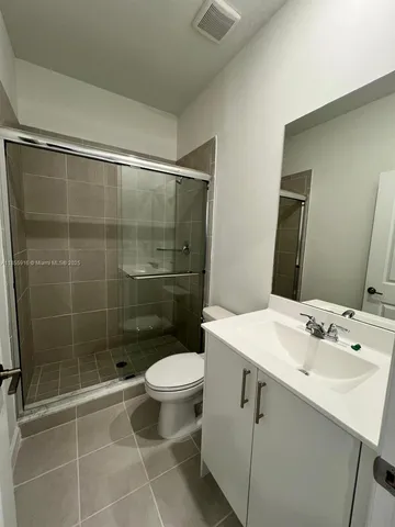 an empty room with a projector and a window