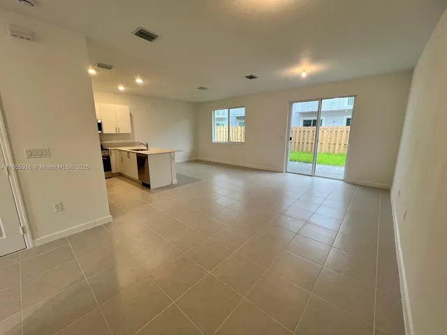 a view of a livingroom with a kitchen
