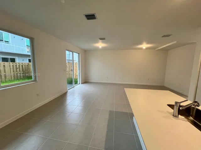 a view of a room with windows