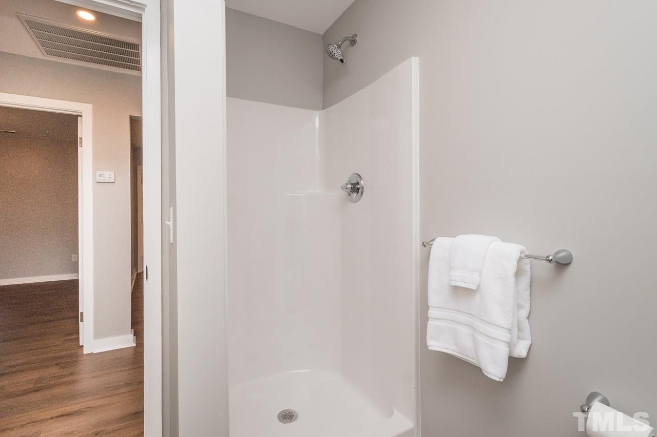 166 Hannah Creek Road Four Oaks, NC 27524 - Photo 11 of 20 a bathroom with a shower