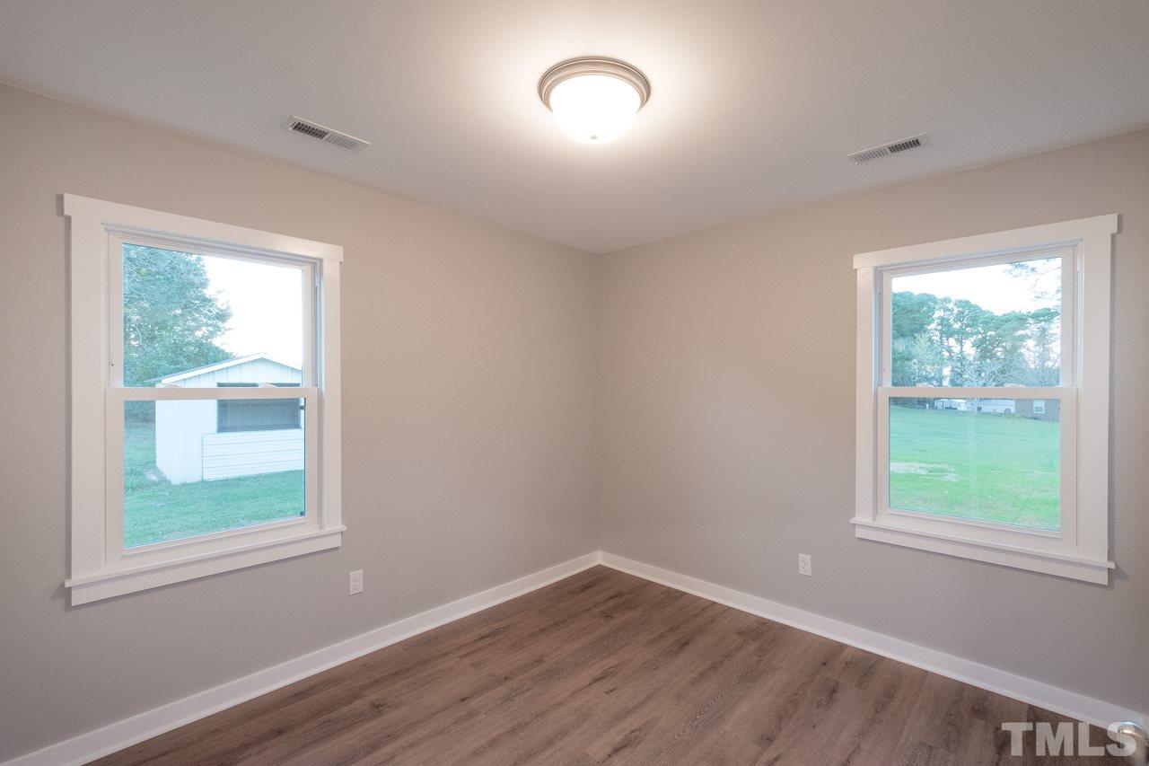 166 Hannah Creek Road Four Oaks, NC 27524 - Photo 13 of 20 an empty room with a window