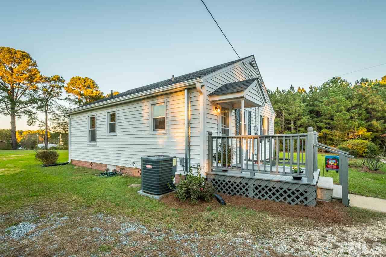 166 Hannah Creek Road Four Oaks, NC 27524 - Photo 16 of 20 a view of a house with a yard