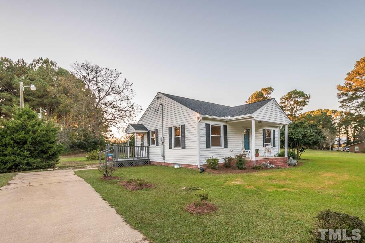 166 Hannah Creek Road Four Oaks, NC 27524 - Photo 19 of 20 a front view of house with yard and green space