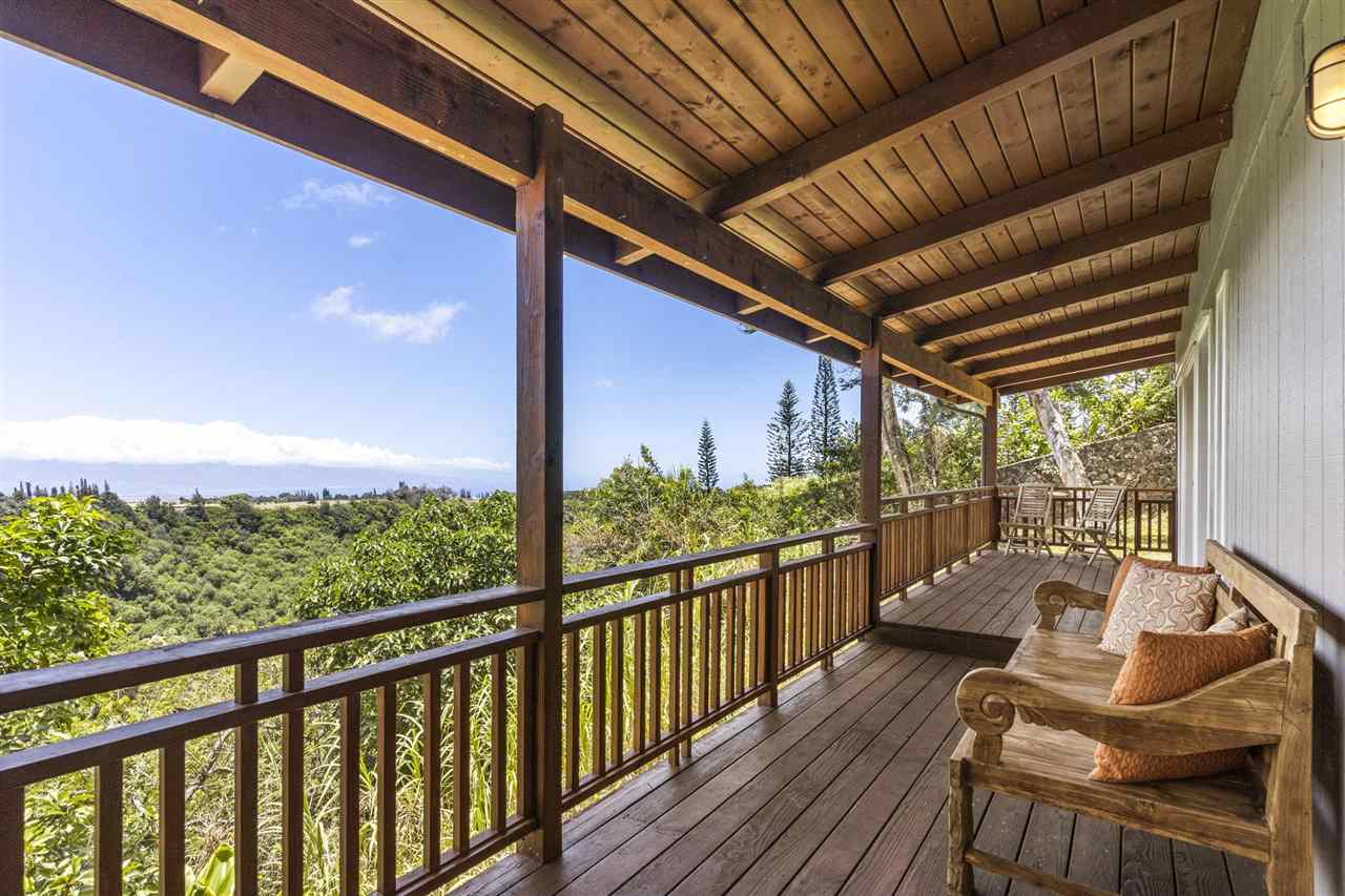 2560 Kokomo Road Haiku, HI 96708 - Photo 2 of 30 a view of balcony with couch and wooden floor