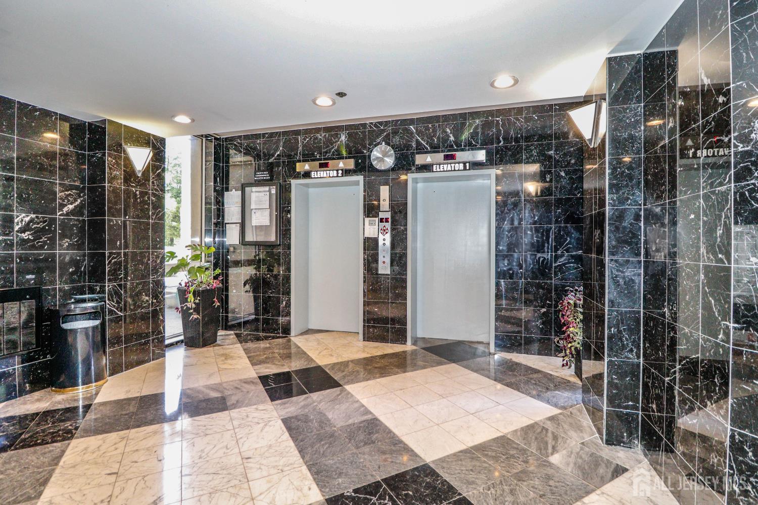 40 Fayette Street, Unit 57 Perth Amboy, NJ 08861 - Photo 31 of 33 a bathroom with a glass shower door