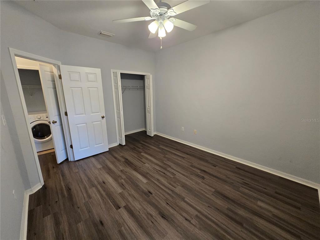 7976 48 Way Gainesville, FL 32653 - Photo 16 of 26 an empty room with wooden floor and windows