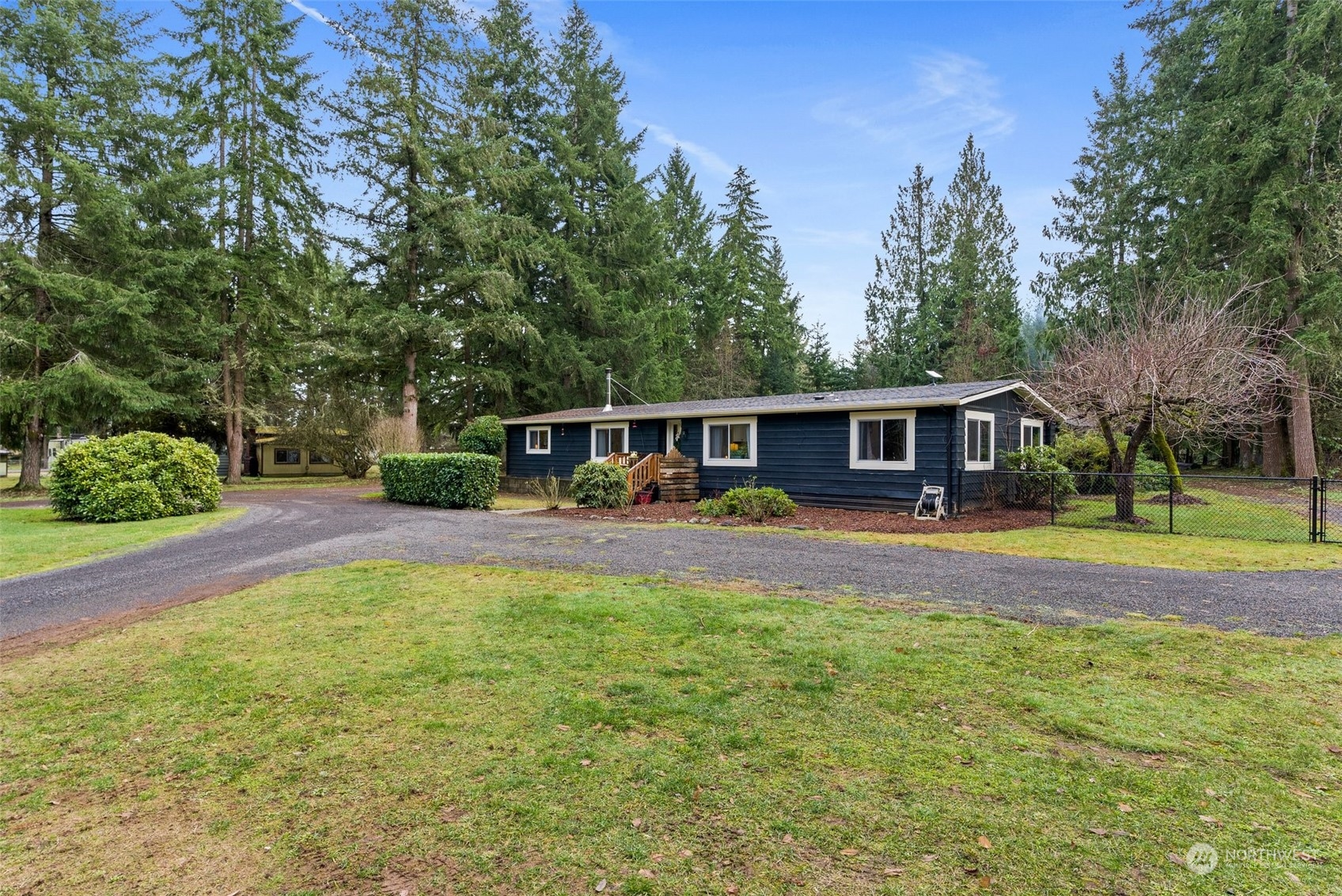 454 Harmon Road, Unit 11 Chehalis, WA 98532 - Photo 25 of 28 a view of a house with backyard and a patio