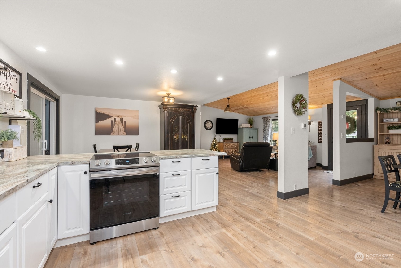 454 Harmon Road, Unit 11 Chehalis, WA 98532 - Photo 9 of 28 a kitchen with stainless steel appliances kitchen island granite countertop a stove and cabinets