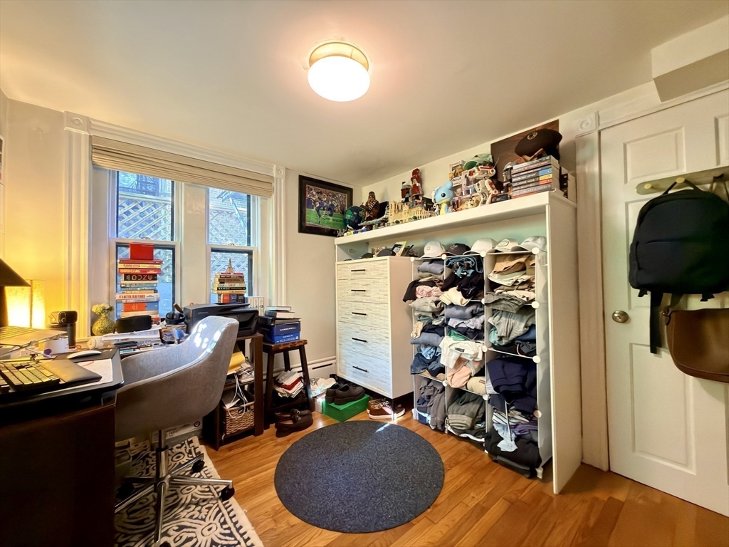 41 Pinckney Street, Unit B Boston, MA 02114 - Photo 29 of 31 a room with gym equipment and a window