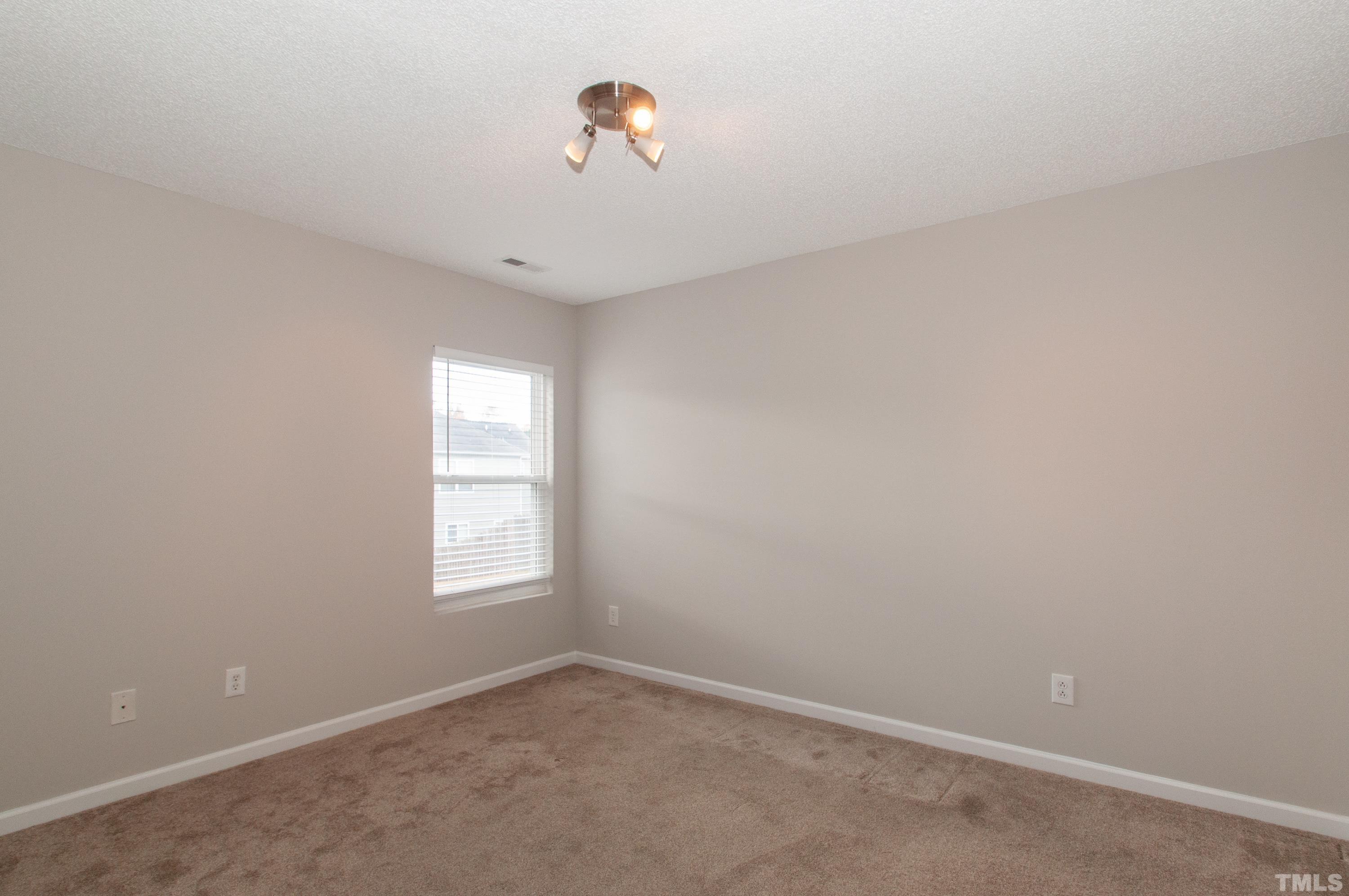 3808 Tryon Ridge Drive Raleigh, NC 27610 - Photo 14 of 30 an empty room with a window