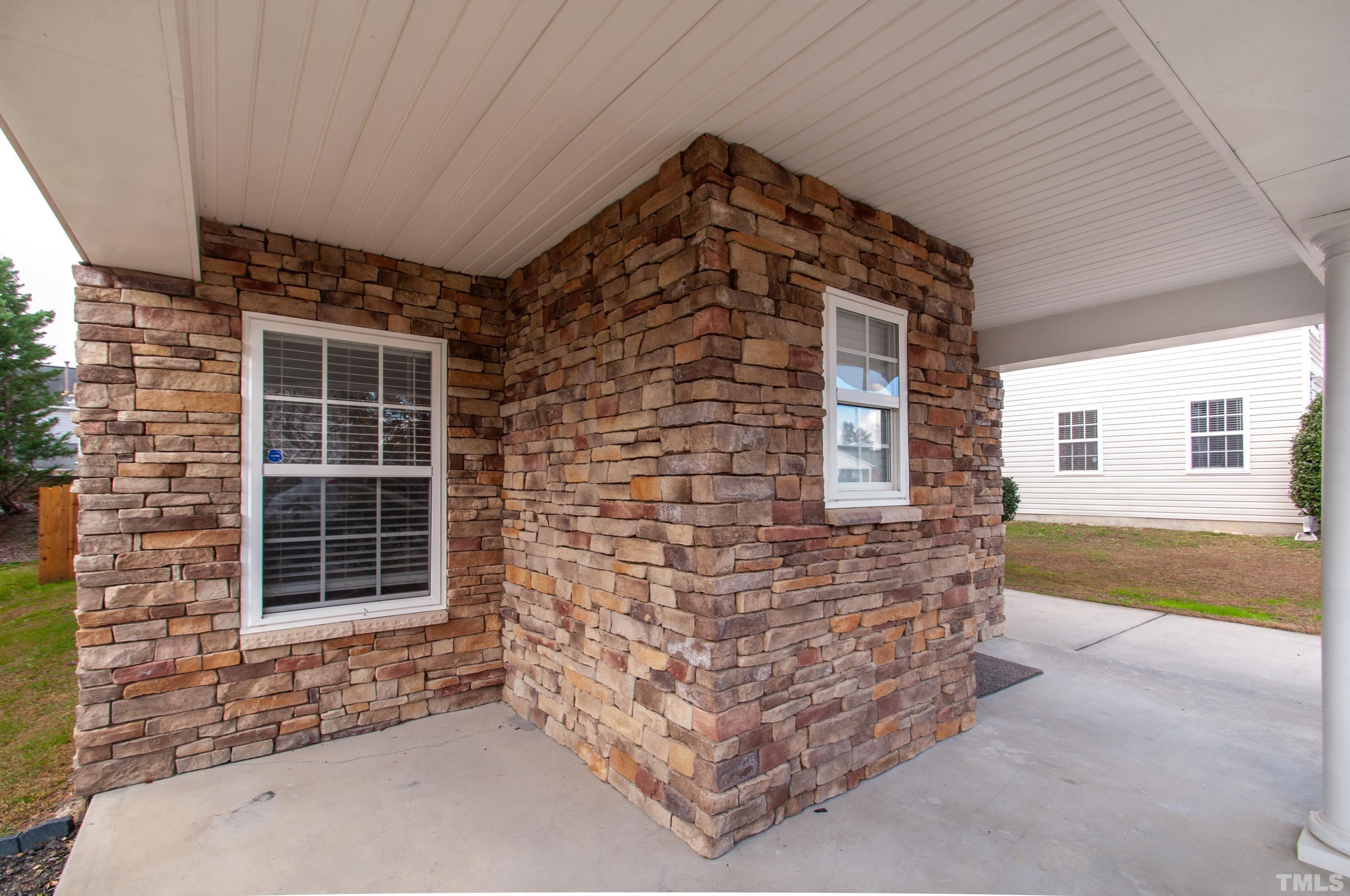 3808 Tryon Ridge Drive Raleigh, NC 27610 - Photo 23 of 30 a front view of a house with glass windows