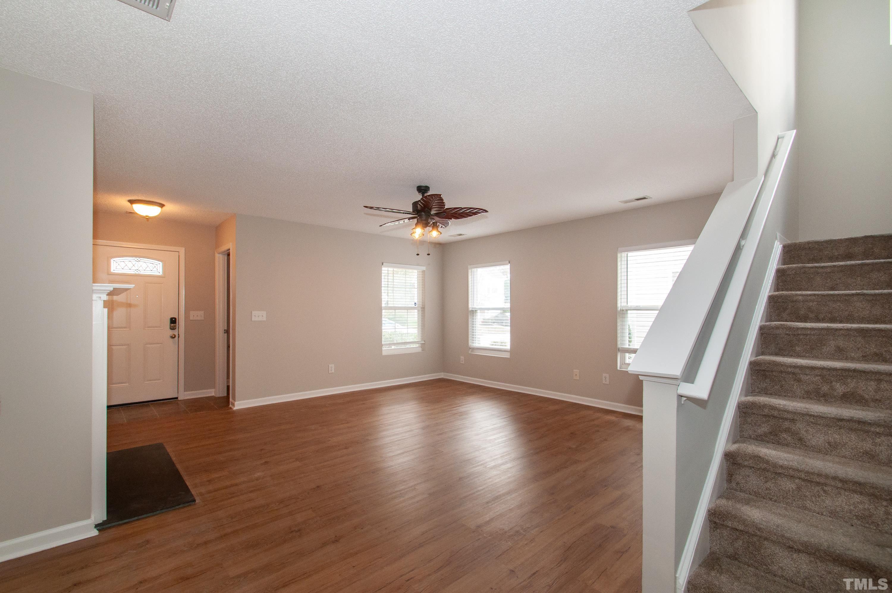 3808 Tryon Ridge Drive Raleigh, NC 27610 - Photo 5 of 30 wooden floor in an empty room with a window