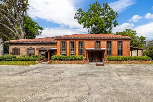 a front view of a house with a yard and porch