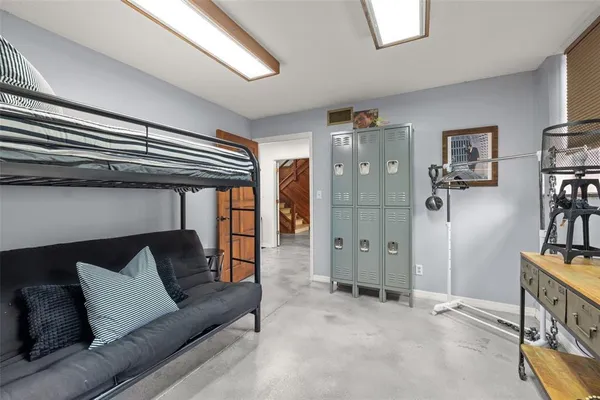 a bedroom with a large bed and a walk in closet