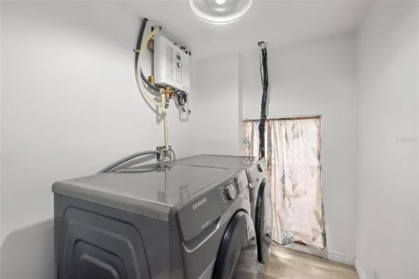 a bathroom with a toilet a sink and a mirror