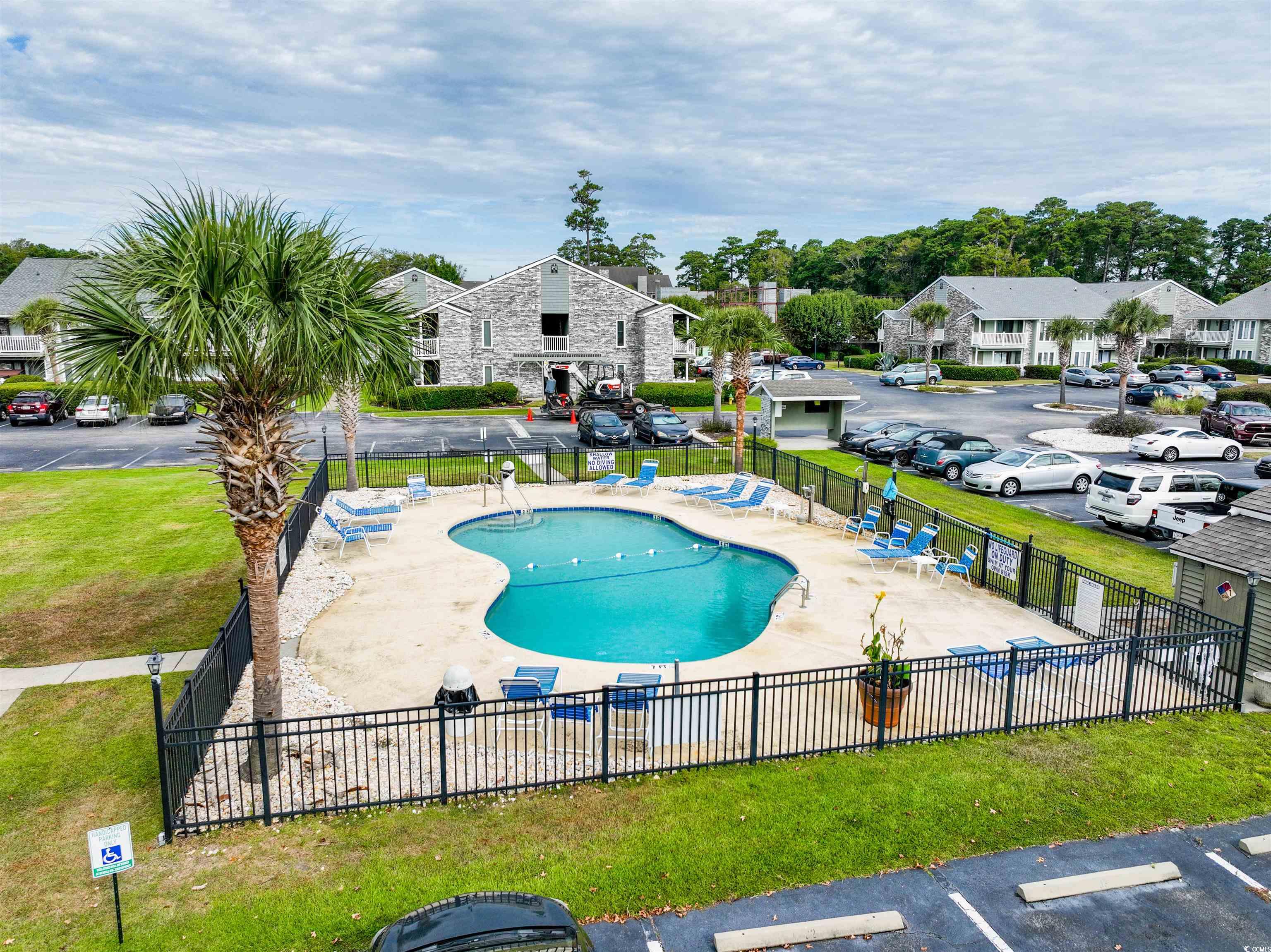 4708 Cobblestone Drive, Unit I8 Myrtle Beach, SC 29577 - Photo 14 of 15 Community pool with a residential view and a patio