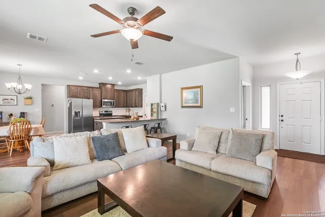 a view of a dining room with furniture and window