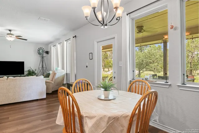 a kitchen with kitchen island granite countertop a sink stove and refrigerator