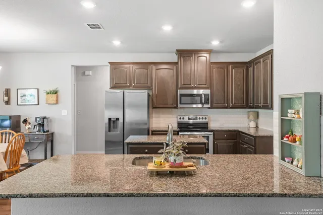 a bedroom with a bed and a lamp