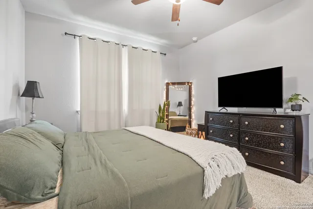 a bathroom with a shower and a sink
