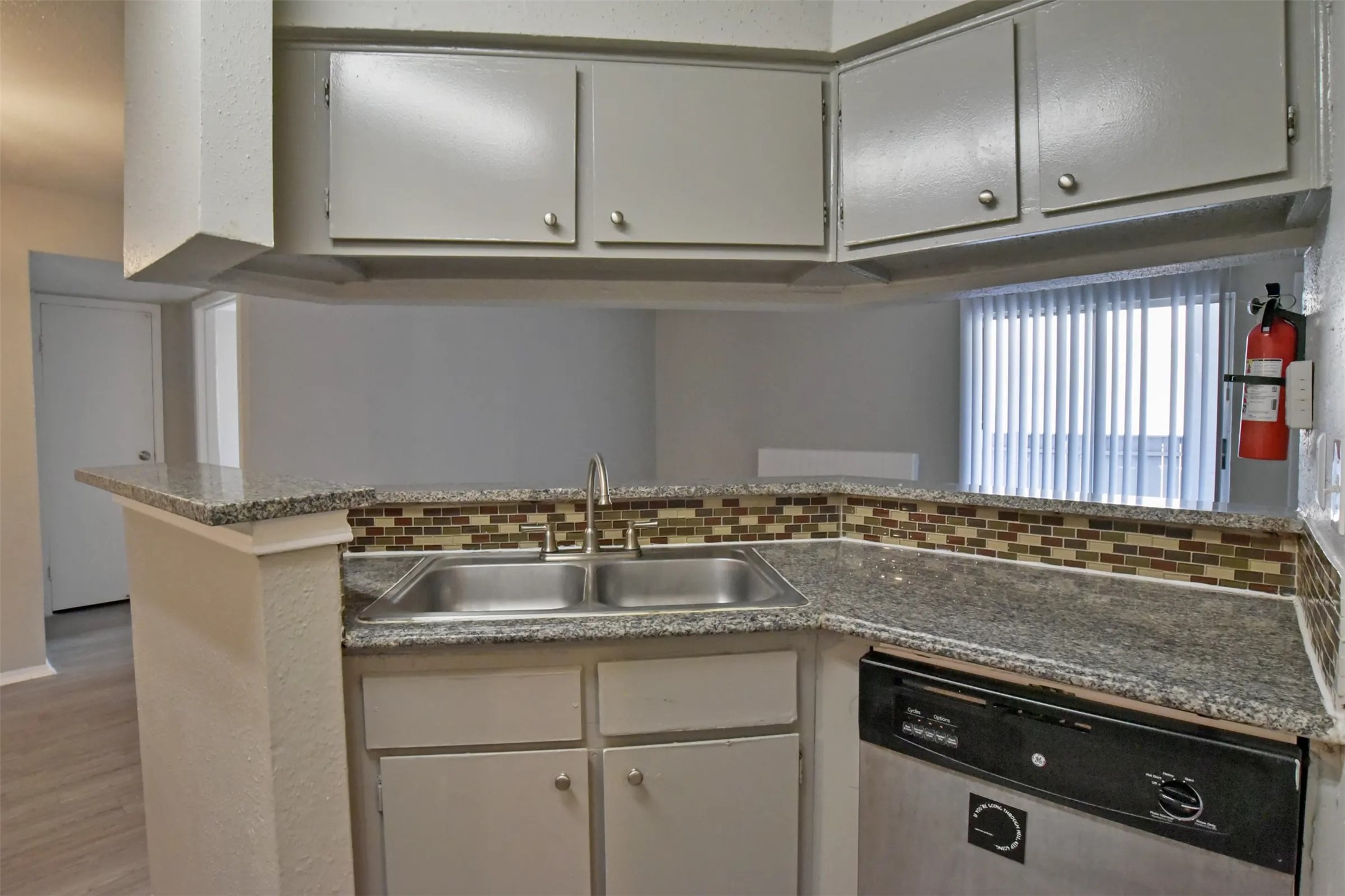 2700 South Dairy Ashford Road, Unit 511D Houston, TX 77082 - Photo 7 of 15 a view of a kitchen with granite countertop cabinets