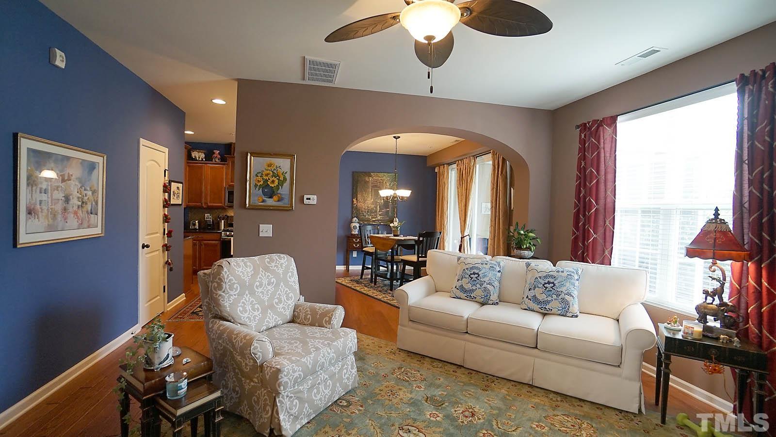 10115 Barnhart Way Raleigh, NC 27617 - Photo 12 of 60 a living room with furniture and a large window
