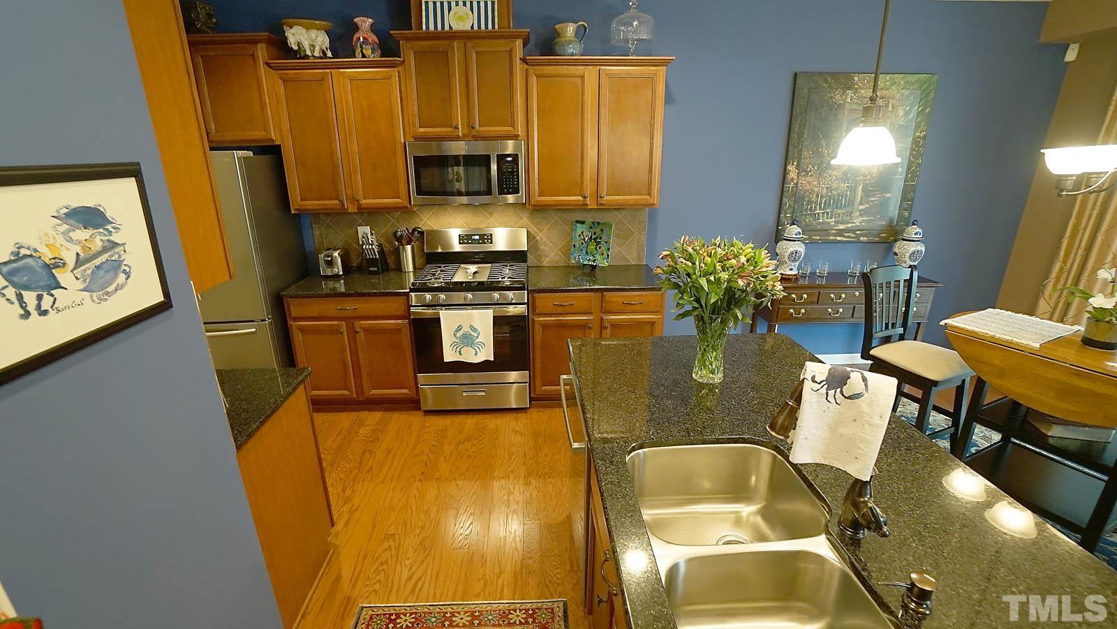 10115 Barnhart Way Raleigh, NC 27617 - Photo 24 of 60 a dining table chair next to a window