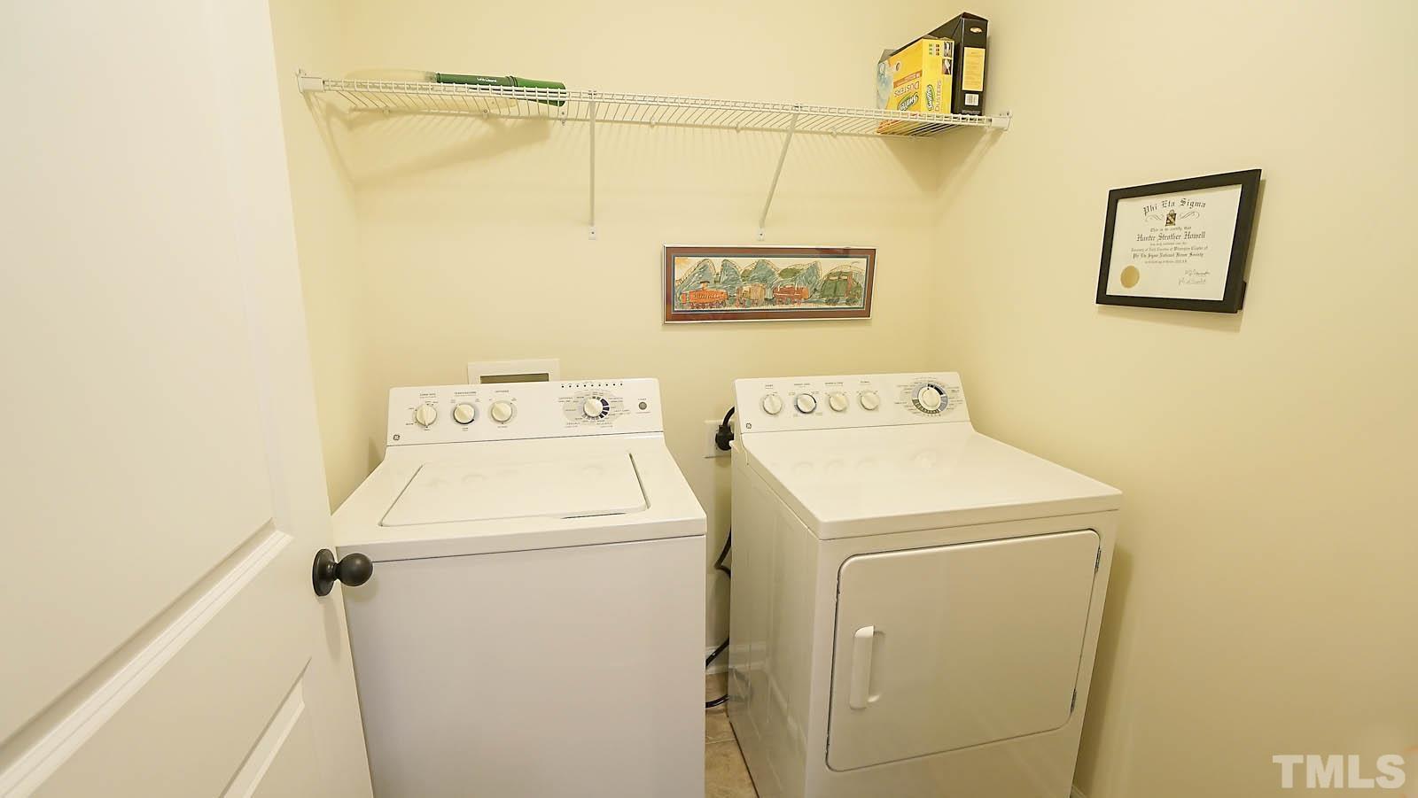 10115 Barnhart Way Raleigh, NC 27617 - Photo 32 of 60 a utility room with dryer and washer