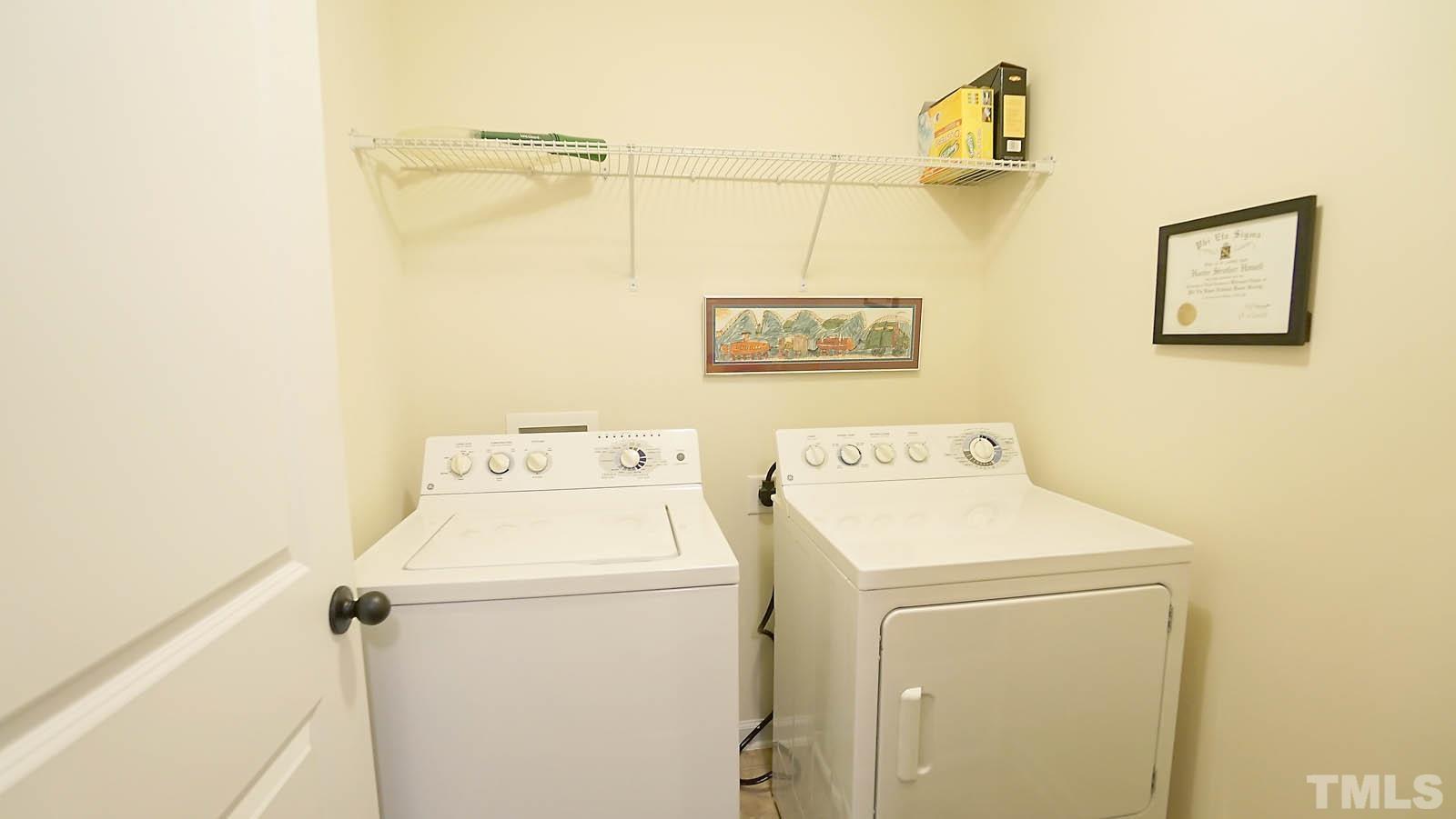 10115 Barnhart Way Raleigh, NC 27617 - Photo 33 of 60 a utility room with dryer and washer