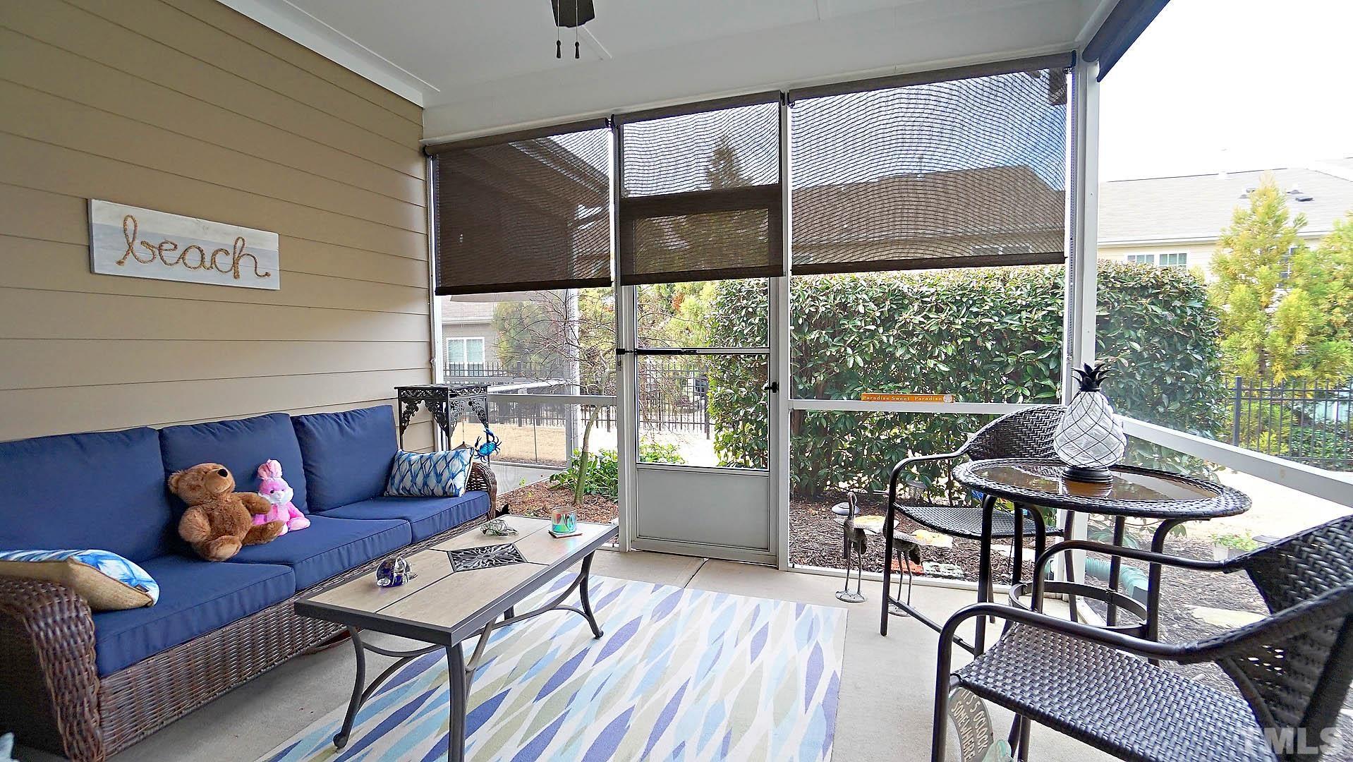10115 Barnhart Way Raleigh, NC 27617 - Photo 49 of 60 a living room with furniture and a large window