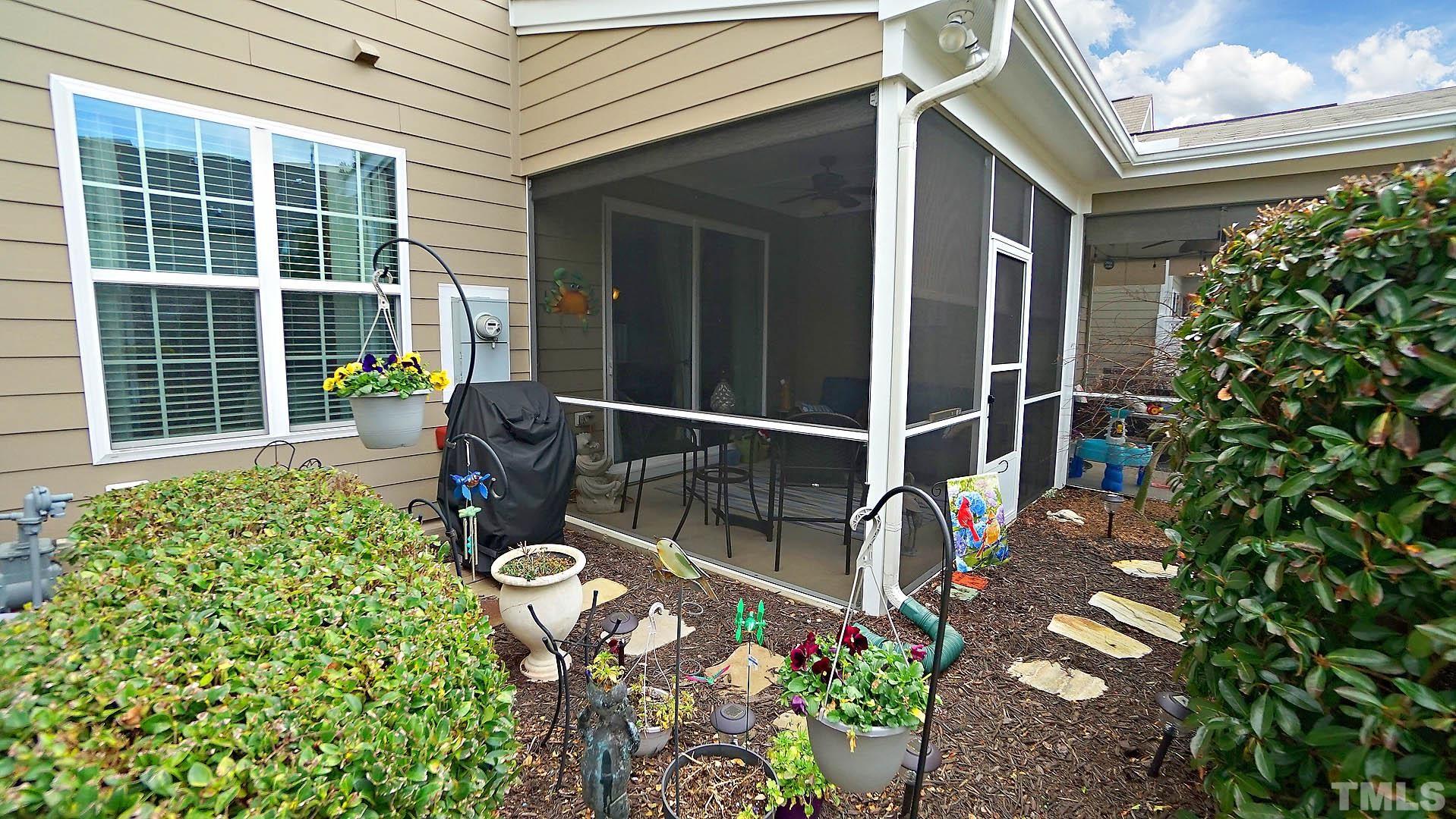 10115 Barnhart Way Raleigh, NC 27617 - Photo 53 of 60 a balcony with table and chairs and potted plants