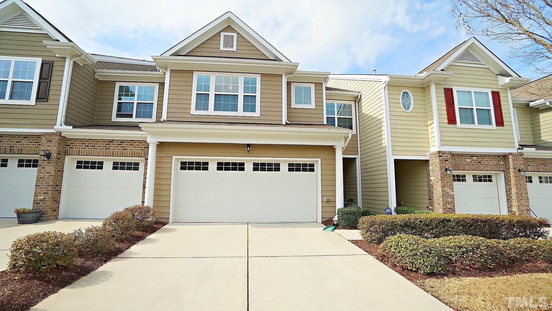 10115 Barnhart Way Raleigh, NC 27617 - Photo 59 of 60 a front view of a house with a yard and garage