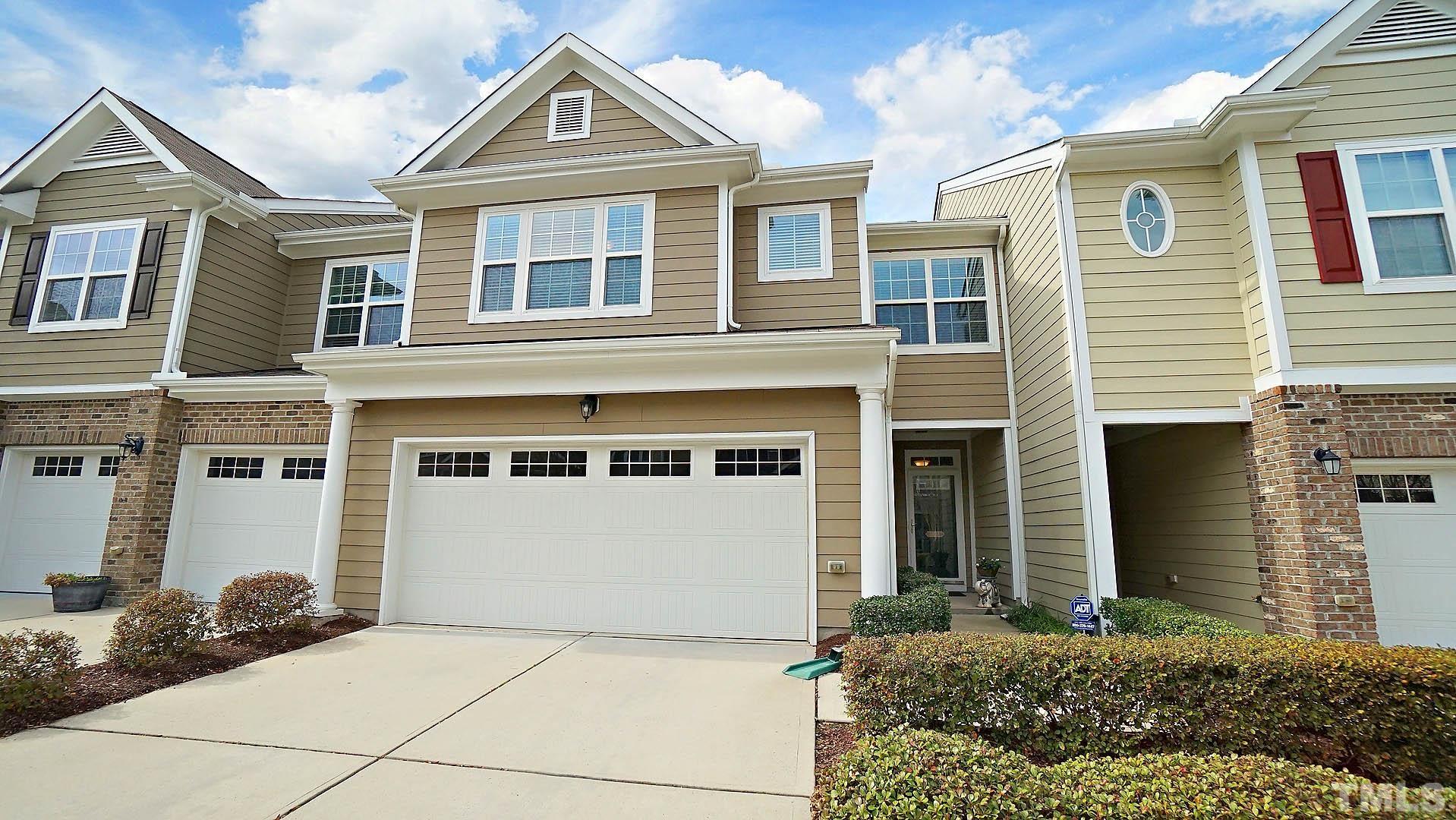 10115 Barnhart Way Raleigh, NC 27617 - Photo 60 of 60 a front view of a house with a yard and garage
