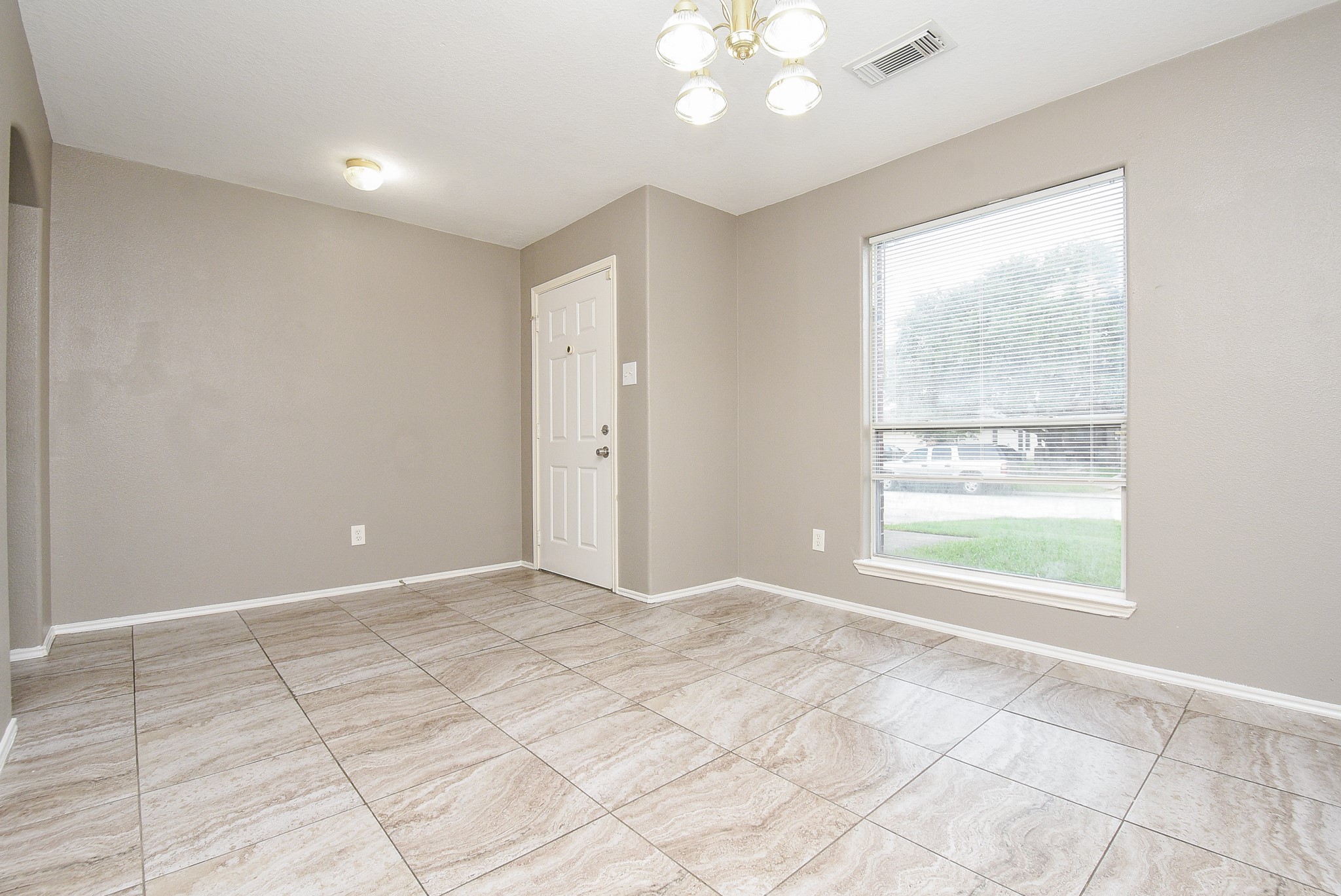 642 Kiley Drive Houston, TX 77073 - Photo 4 of 24 a view of an empty room with a window