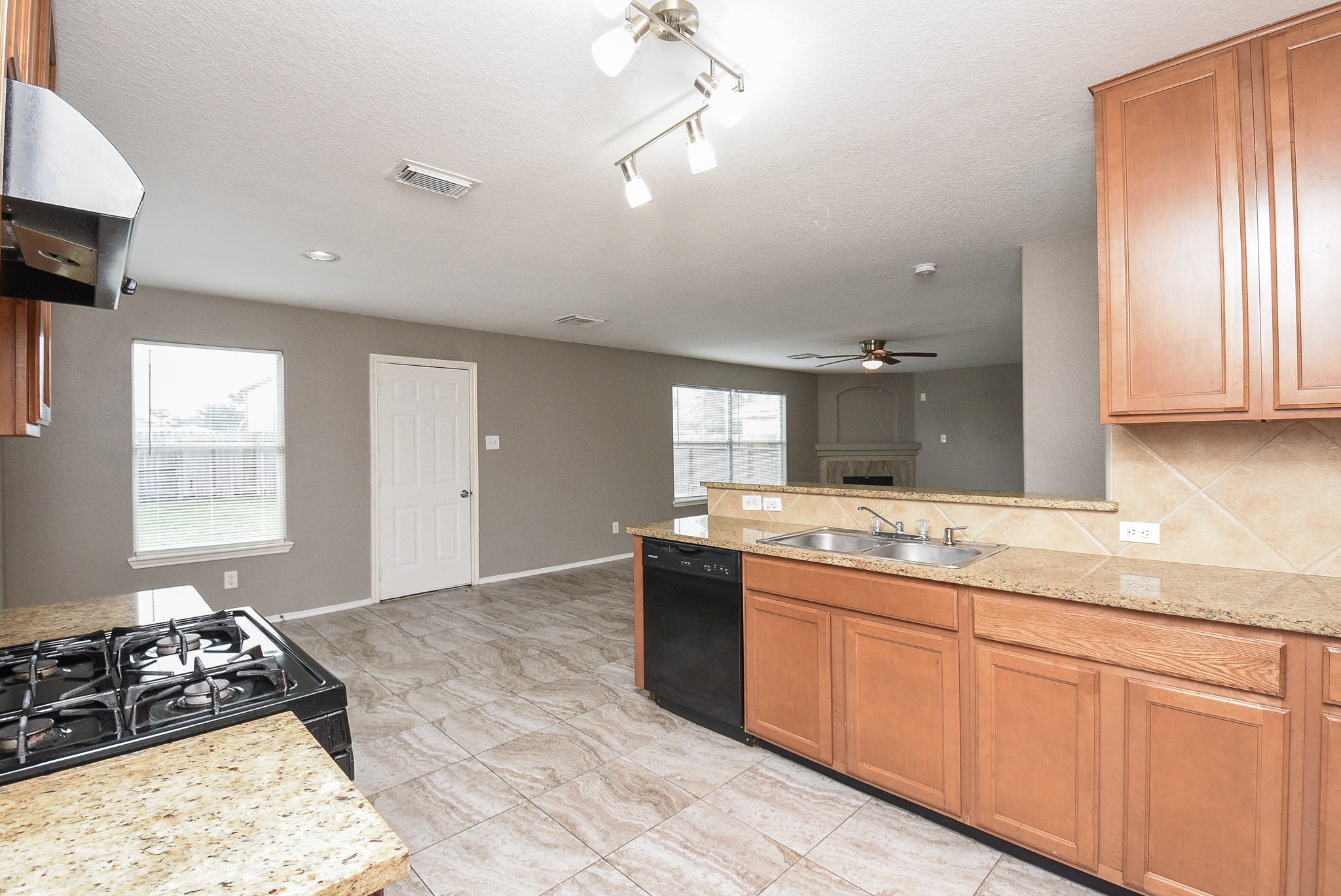 642 Kiley Drive Houston, TX 77073 - Photo 5 of 24 a kitchen with a sink stove and cabinets