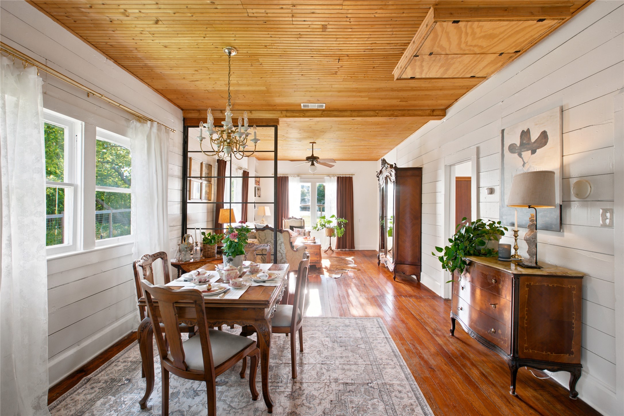 372 Old Lockhart Road Lockhart, TX 78644 - Photo 14 of 40 Rich hardwood flooring extends throughout this generous living and dining space.