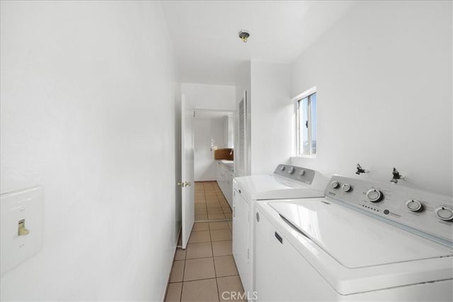 a view of a patio with a chairs and table in the patio