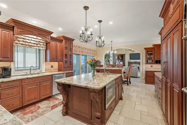 a dining table with chairs and chandelier
