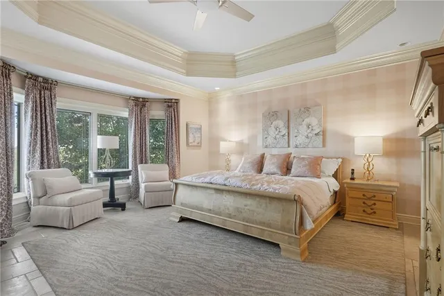 a spacious bedroom with a bed and a couch