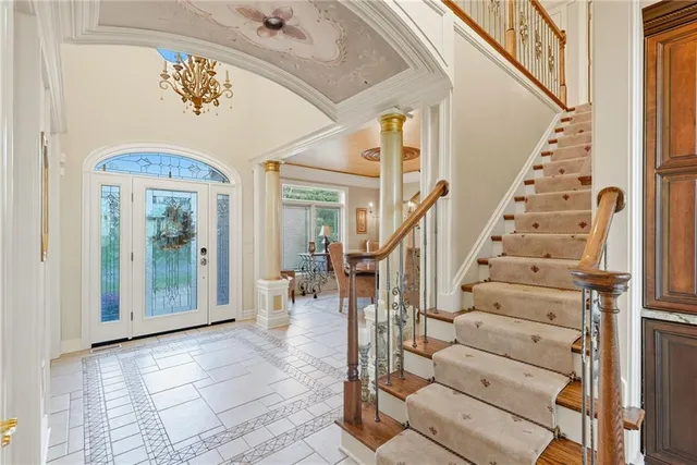 a view of entryway and hall with wooden floor