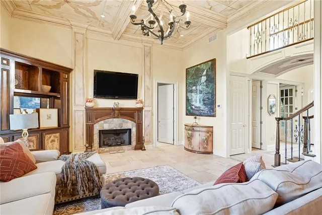 a living room with furniture fireplace and flat screen tv