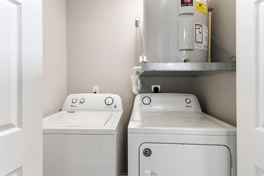 6108 Abrams Road, Unit 521 Dallas, TX 75231 - Photo 17 of 20 Dedicated utility closet featuring a white top-load washing machine and a front-load dryer