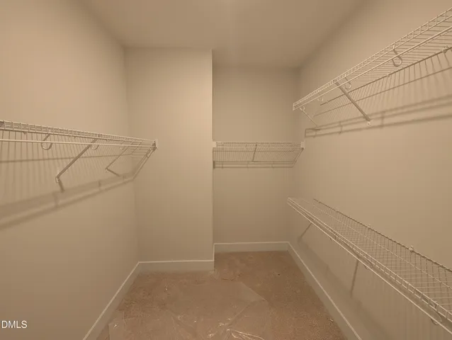 a kitchen with granite countertop a sink and cabinets