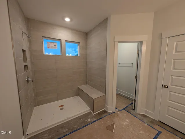 a view of a lake with houses in the back