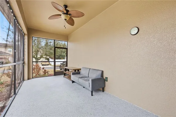 a kitchen with stainless steel appliances granite countertop a stove a refrigerator a kitchen island a dining table and chairs