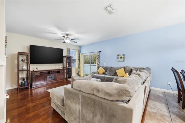 a living room with lots of furniture and a rug