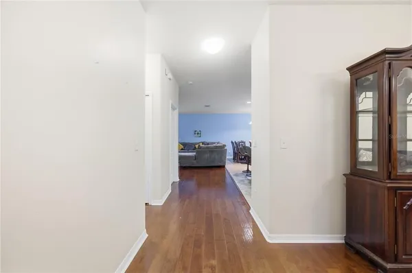 a bathroom with a granite countertop sink a toilet and a mirror